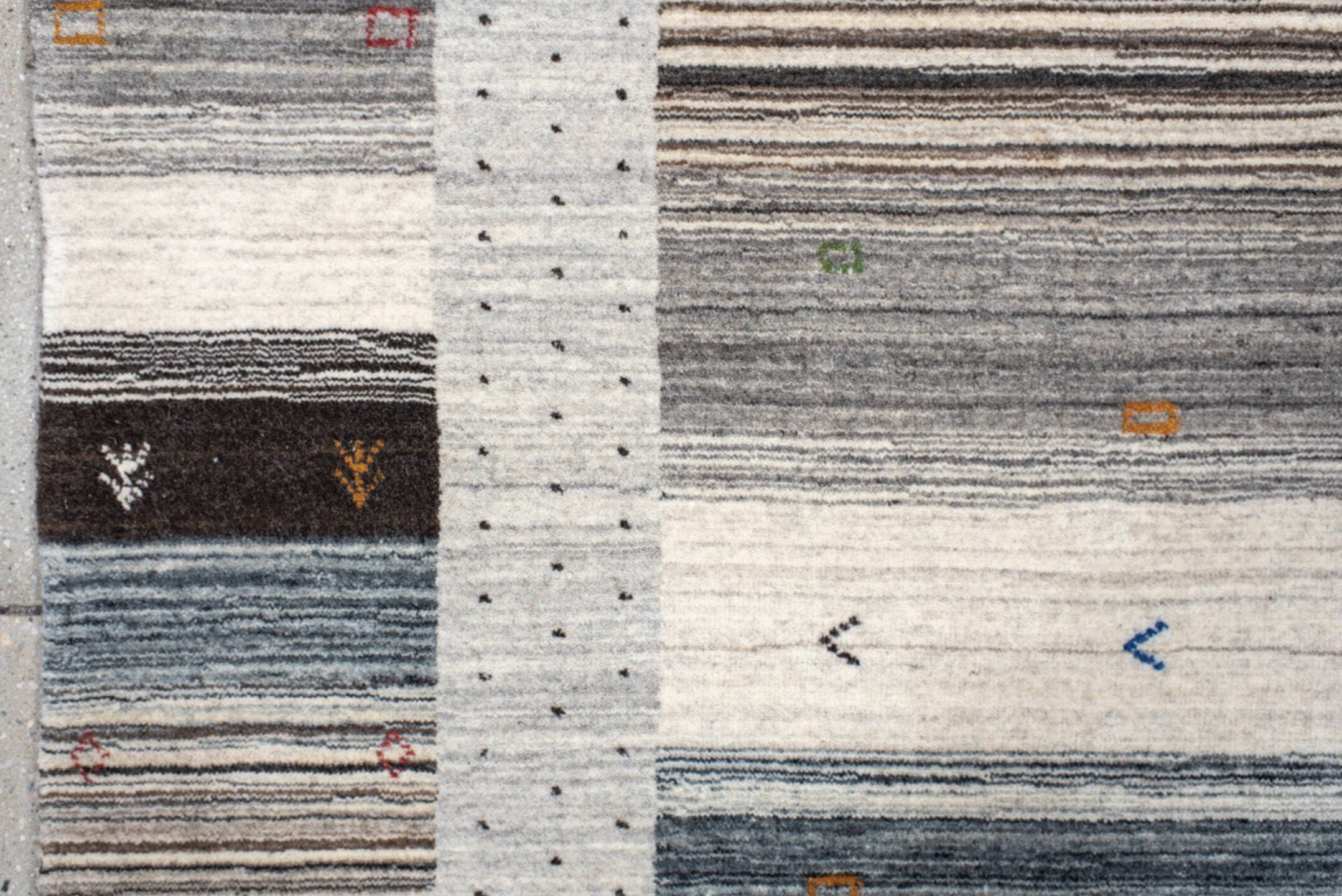 5' x 7' one-of-a-kind handmade vintage Gabbe rug. Color palette: charcoal, ivory, gray, slate, cream, gold, red, green