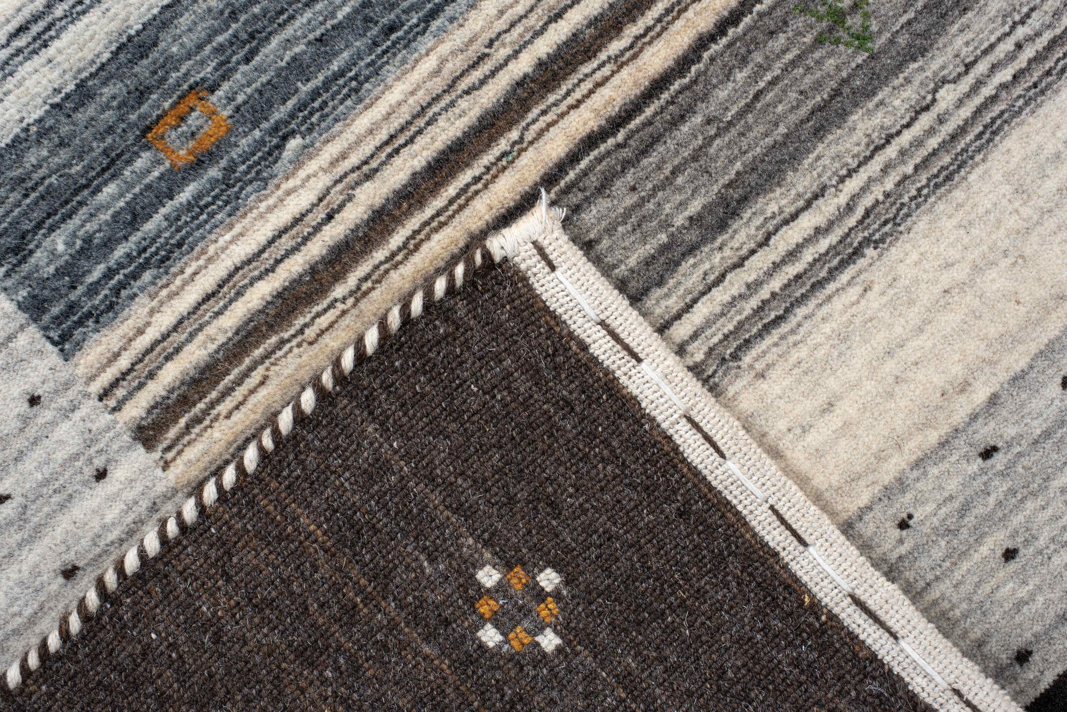 5' x 7' one-of-a-kind handmade vintage Gabbe rug. Color palette: black, blue, brown, charcoal, dark gray, dim gray