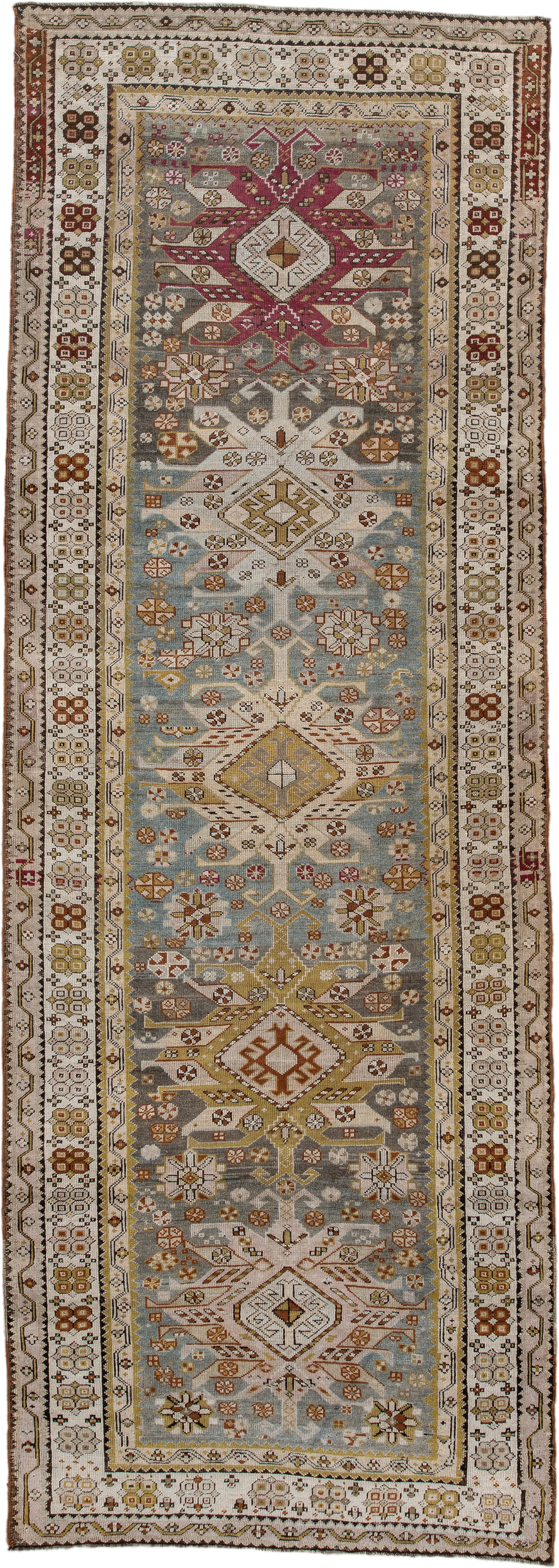 3' x 10' one-of-a-kind handmade antique Caucasian runner rug. Color palette: ivory, pale blue, taupe, rose, rust, gold, sage