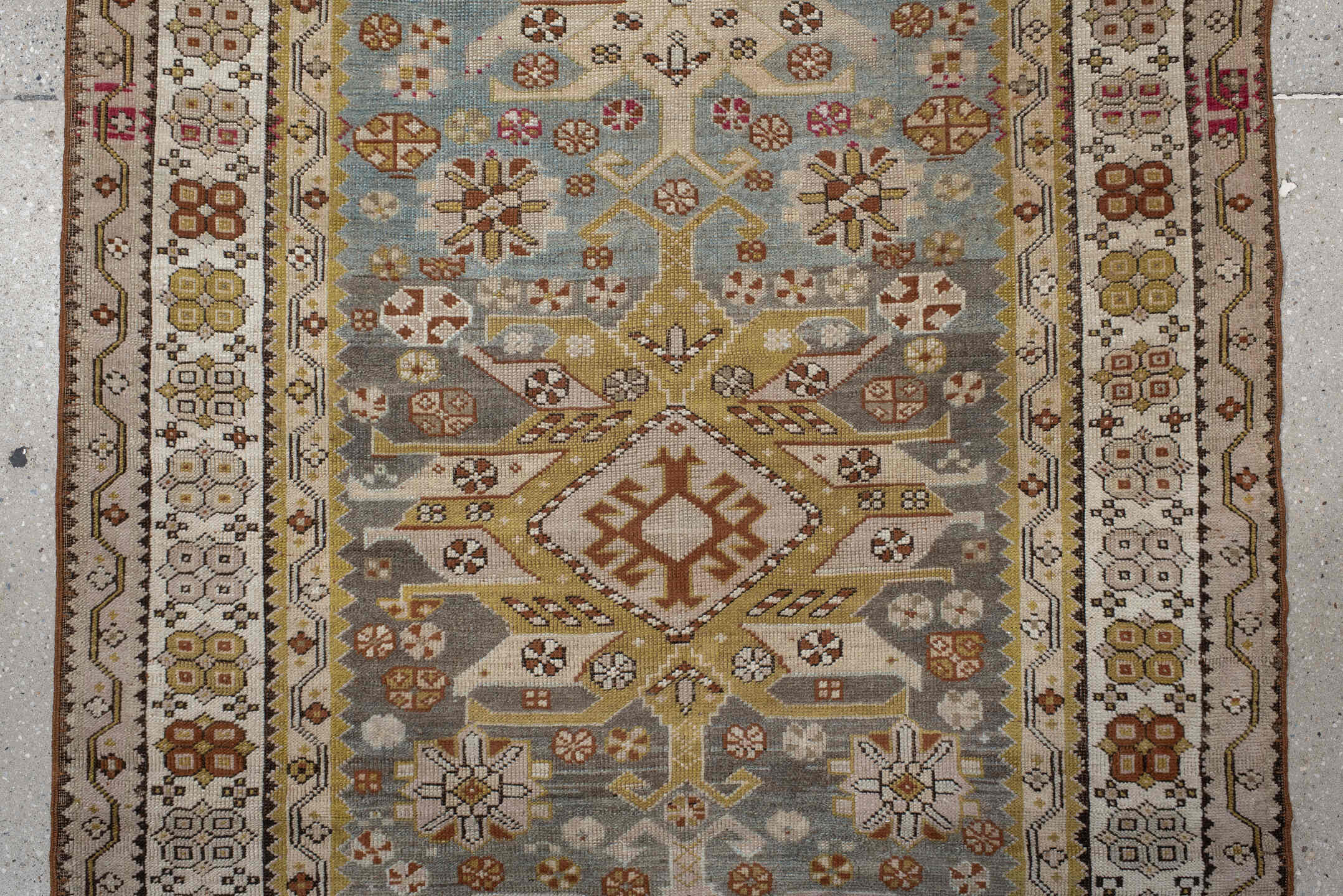 3' x 10' one-of-a-kind handmade antique Caucasian runner rug. Color palette: ivory, pale blue, taupe, rose, rust, gold, sage