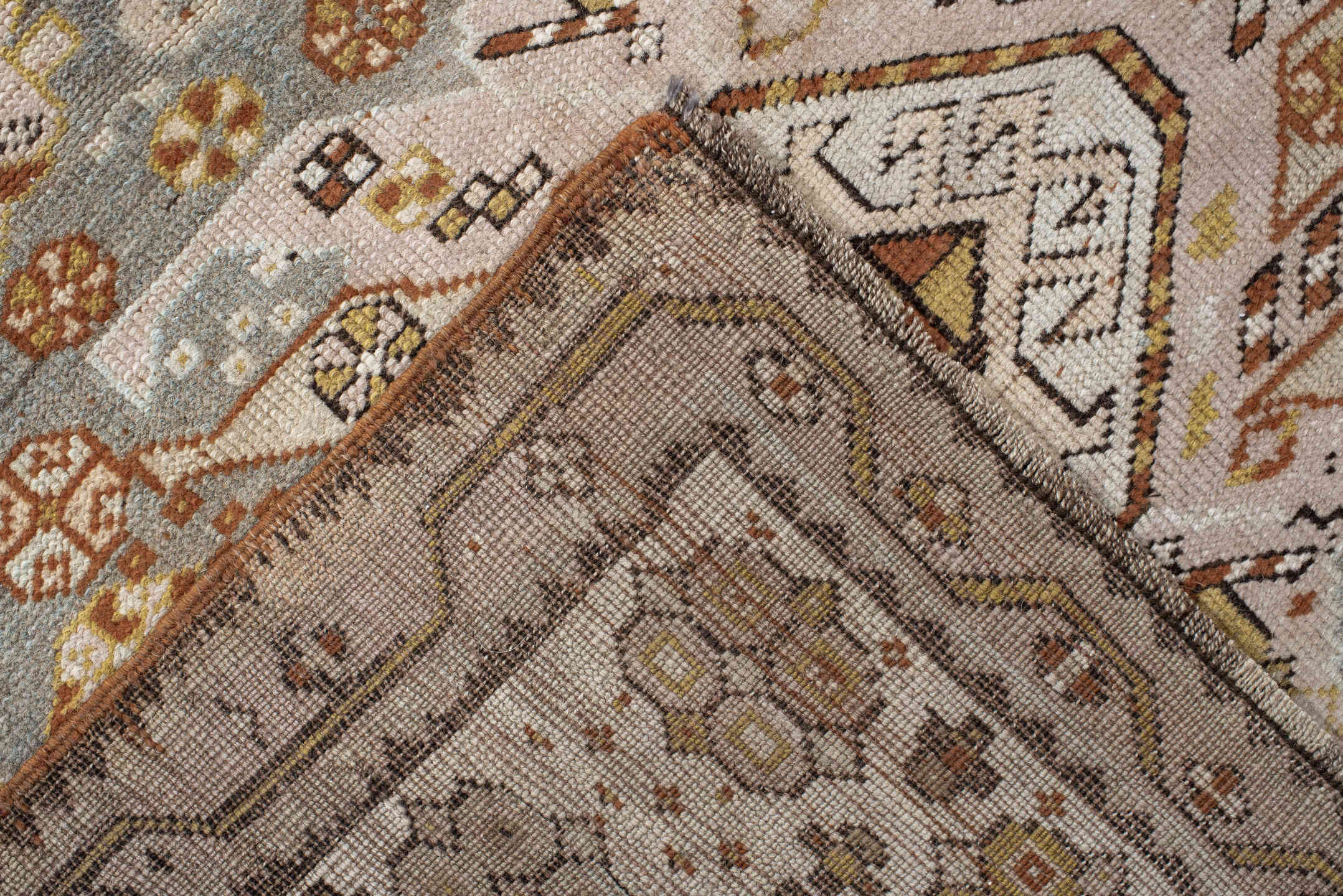 3' x 10' one-of-a-kind handmade antique Caucasian runner rug. Color palette: ivory, pale blue, taupe, rose, rust, gold, sage