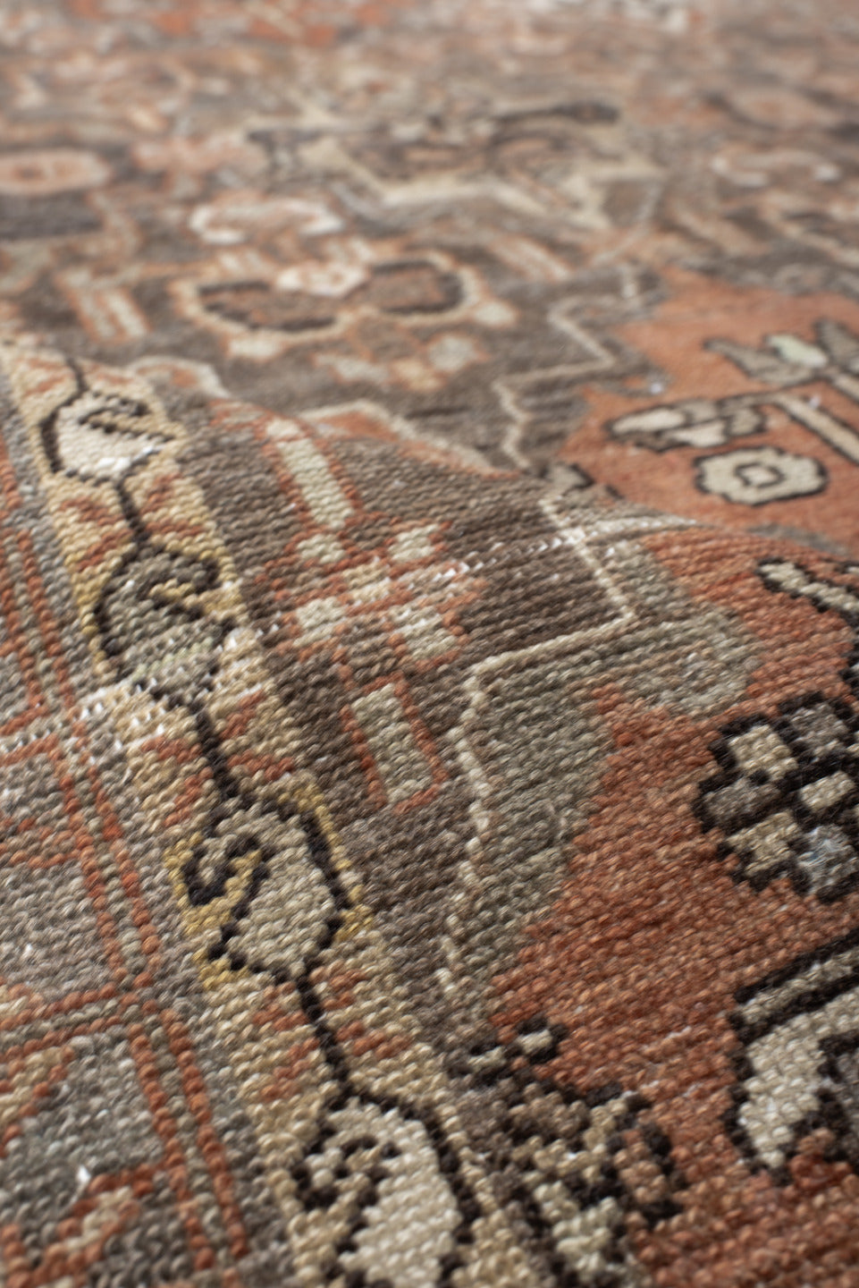 4' x 7' one-of-a-kind handmade vintage Baktiary rug. Color palette: taupe, terra cotta, ivory, slate, camel, charcoal, rose