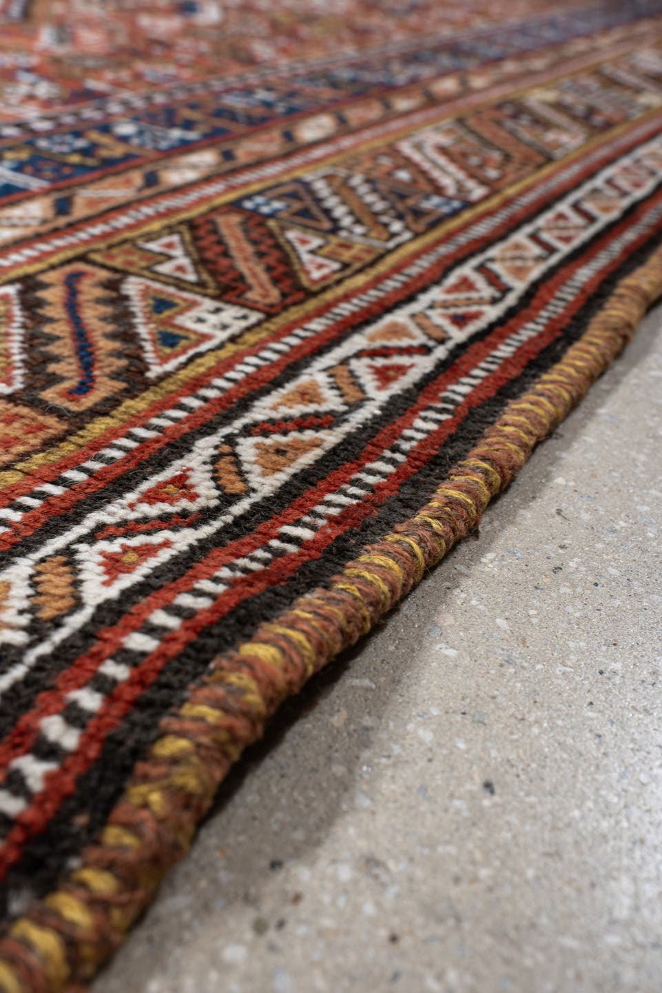 6' x 11' one-of-a-kind handmade antique Qashqai large size rug. Color palette: rust, navy, ivory, terracotta, camel