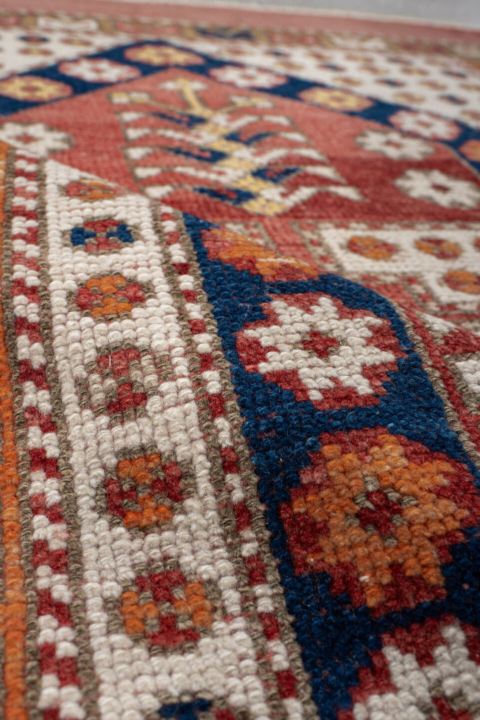 3' x 4' one-of-a-kind handmade antique Anatolian small size rug. Color palette: terracotta, ivory, indigo, rust, gold, camel