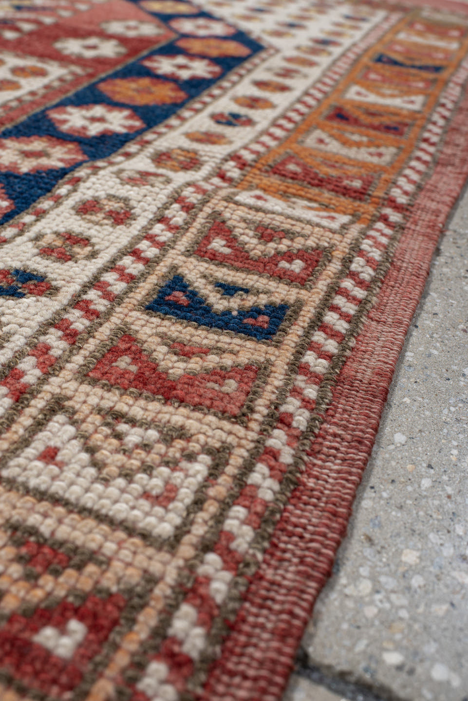 3' x 4' one-of-a-kind handmade antique Anatolian small size rug. Color palette: terracotta, ivory, indigo, rust, gold, camel