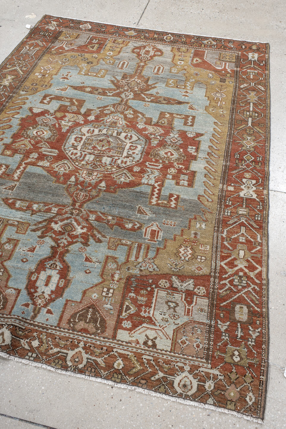 4' x 6' one-of-a-kind handmade vintage Malayer small size rug. Color palette: rust, sky blue, ivory, camel, terra cotta