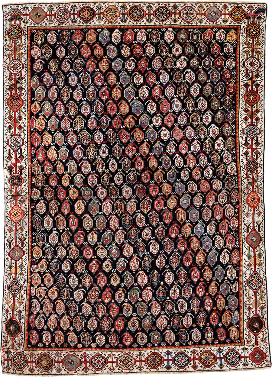 5' x 7' one-of-a-kind handmade vintage Qashqai rug. Color palette: ivory, charcoal, rust, crimson, indigo, camel, slate