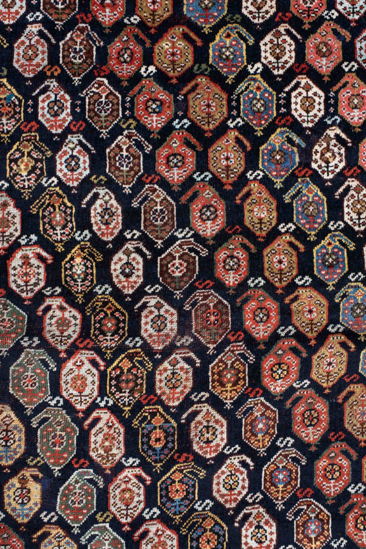 5' x 7' one-of-a-kind handmade vintage Qashqai rug. Color palette: ivory, charcoal, rust, crimson, indigo, camel, slate