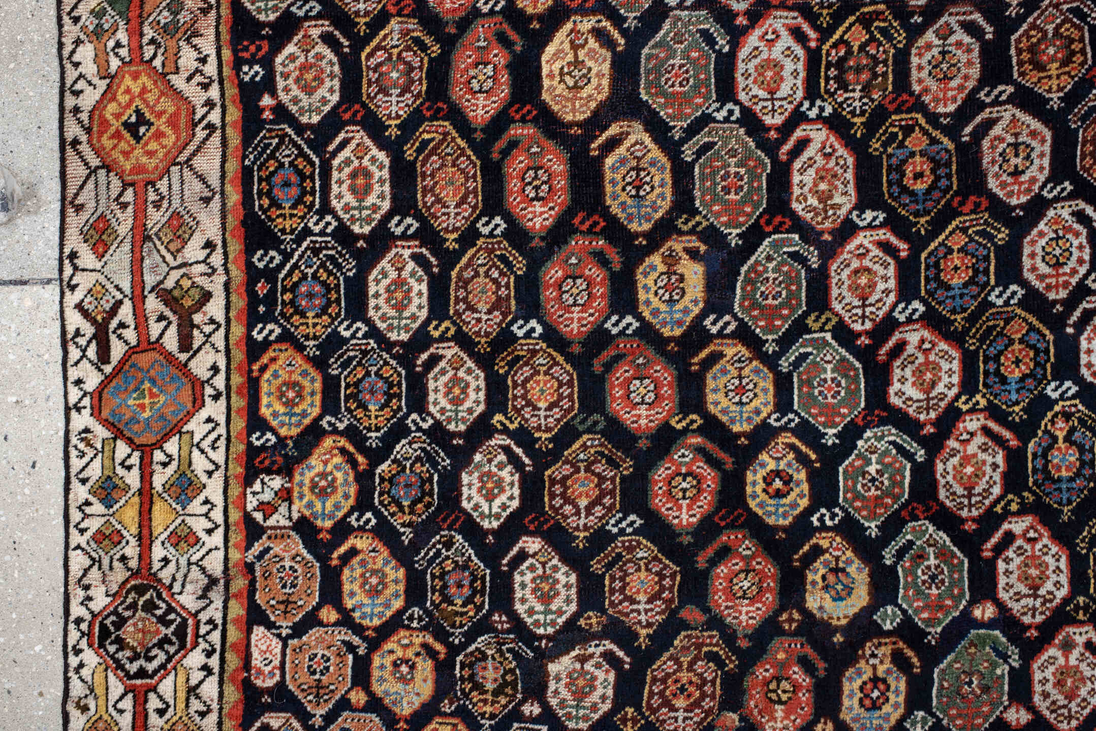 5' x 7' one-of-a-kind handmade vintage Qashqai rug. Color palette: ivory, charcoal, rust, crimson, indigo, camel, slate