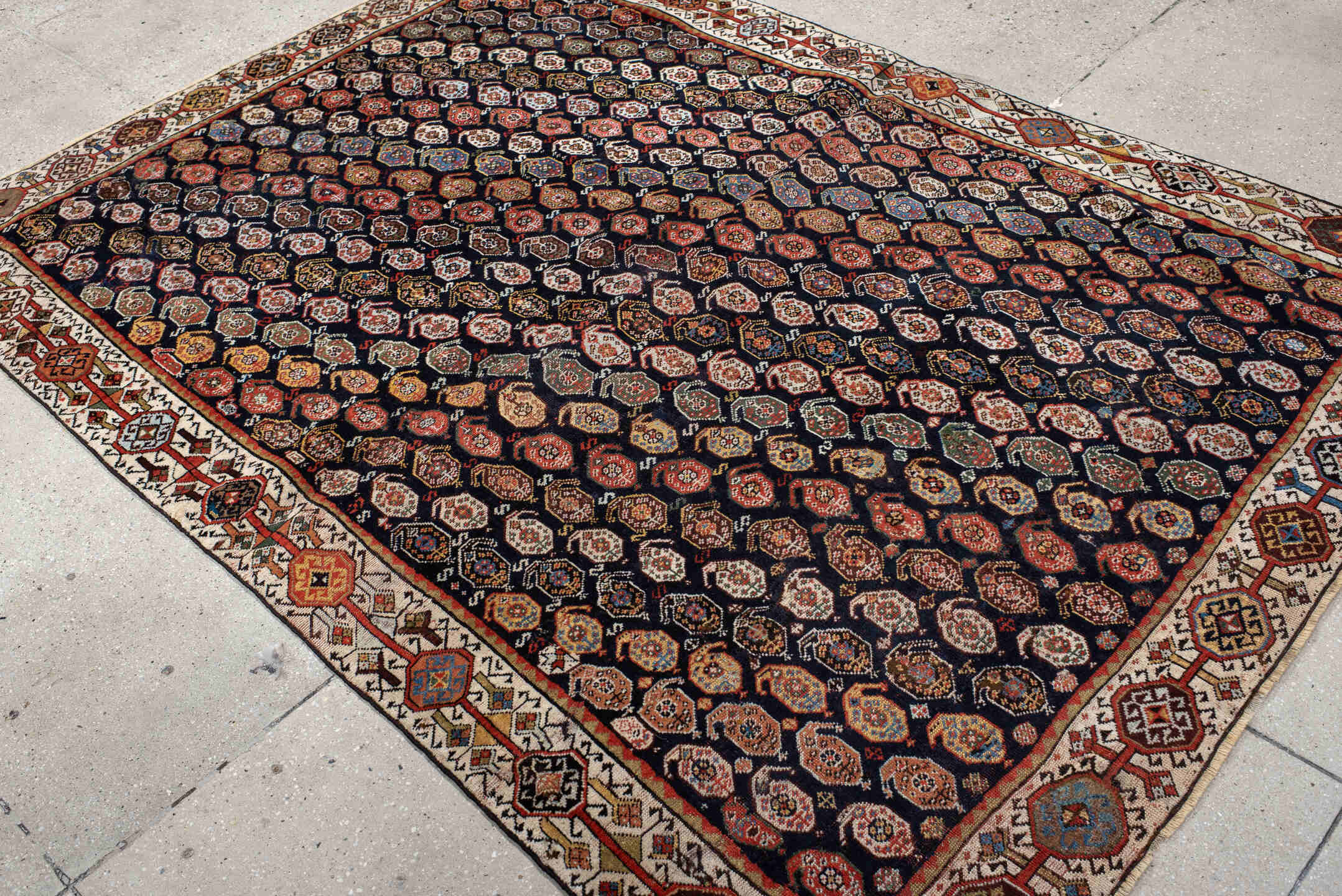 5' x 7' one-of-a-kind handmade vintage Qashqai rug. Color palette: ivory, charcoal, rust, crimson, indigo, camel, slate