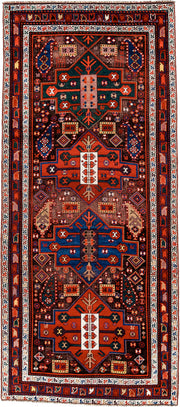 3' x 8' one-of-a-kind handmade antique Caucasian runner rug. Color palette: rust, ivory, navy, indigo, camel, crimson