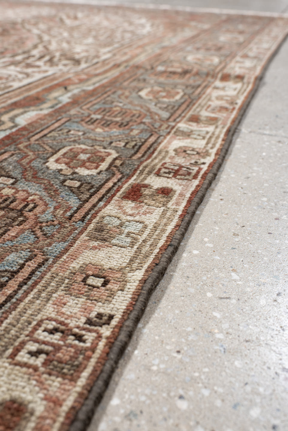 5' x 8' one-of-a-kind handmade antique Baktiary medium size rug. Color palette: ivory, dusty blue, rust, taupe, brown