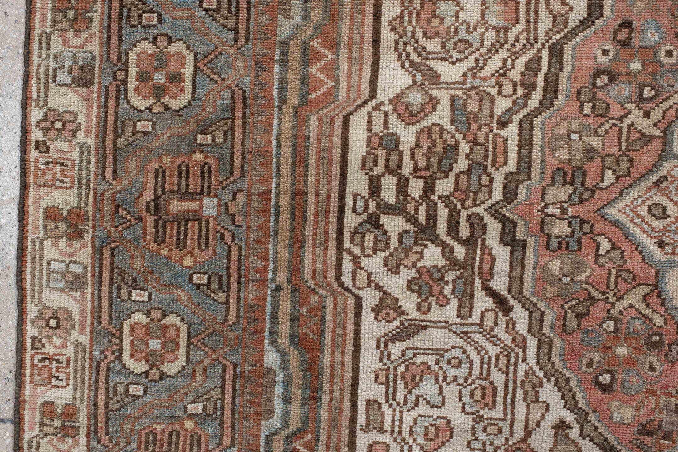 5' x 8' one-of-a-kind handmade antique Baktiary medium size rug. Color palette: ivory, dusty blue, rust, taupe, brown