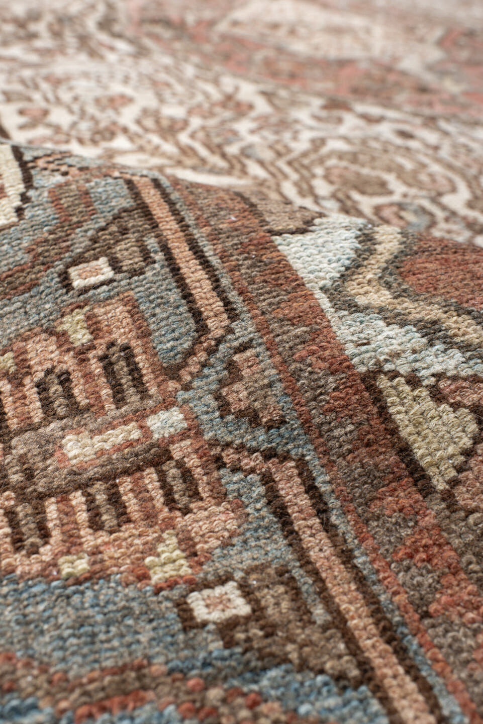 5' x 8' one-of-a-kind handmade antique Baktiary medium size rug. Color palette: ivory, dusty blue, rust, taupe, brown