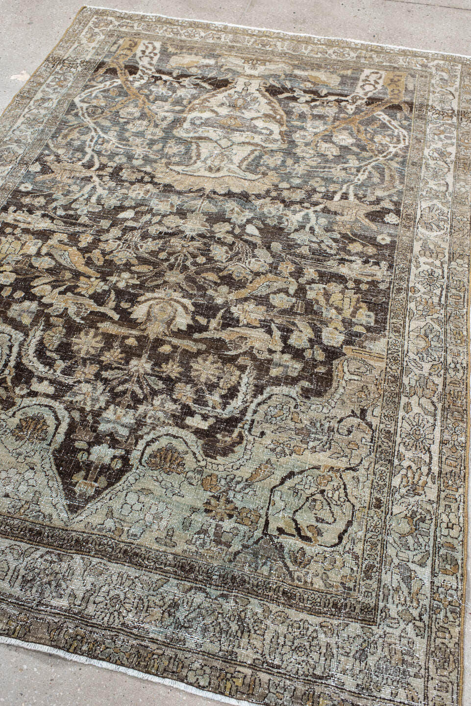 4' x 7' one-of-a-kind handmade vintage Baktiary rug. Color palette: ivory, charcoal, taupe, slate, camel, brown, beige, gray