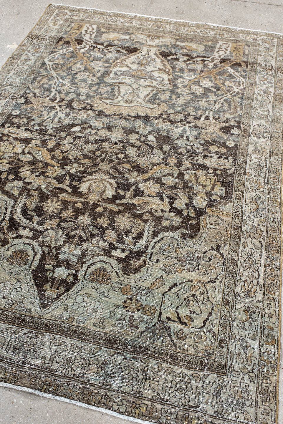 4' x 7' one-of-a-kind handmade vintage Baktiary rug. Color palette: ivory, charcoal, taupe, slate, camel, brown, beige, gray