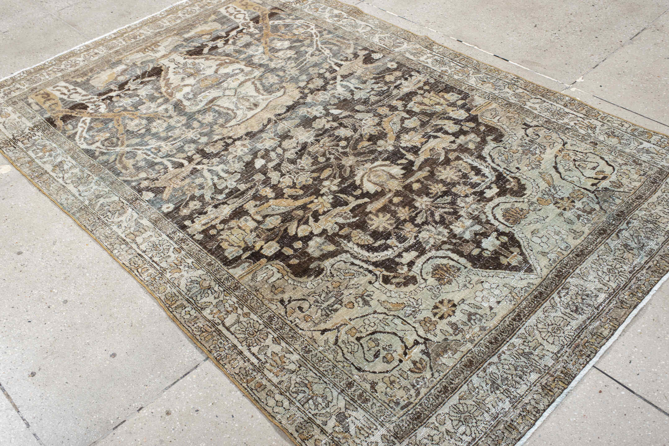 4' x 7' one-of-a-kind handmade vintage Baktiary rug. Color palette: ivory, charcoal, taupe, slate, camel, brown, beige, gray