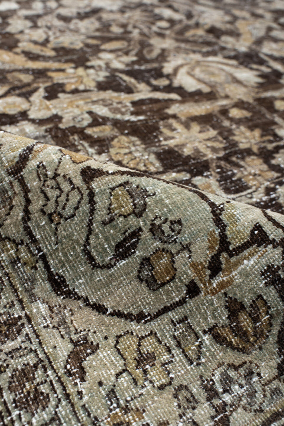 4' x 7' one-of-a-kind handmade vintage Baktiary rug. Color palette: ivory, charcoal, taupe, slate, camel, brown, beige, gray