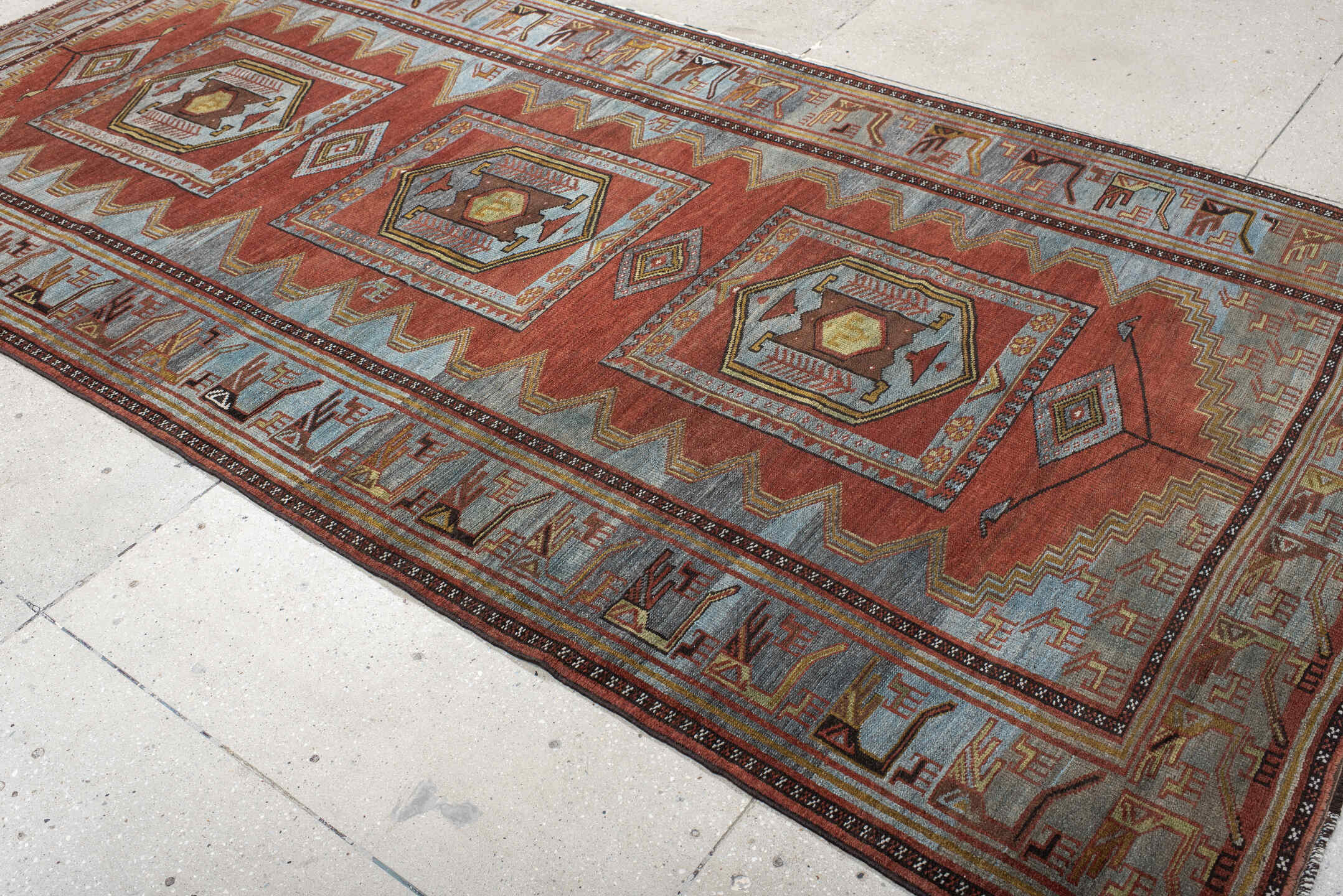 5' x 10' one-of-a-kind handmade antique NW Persian medium size rug. Color palette: rust, ivory, sky blue, camel, charcoal