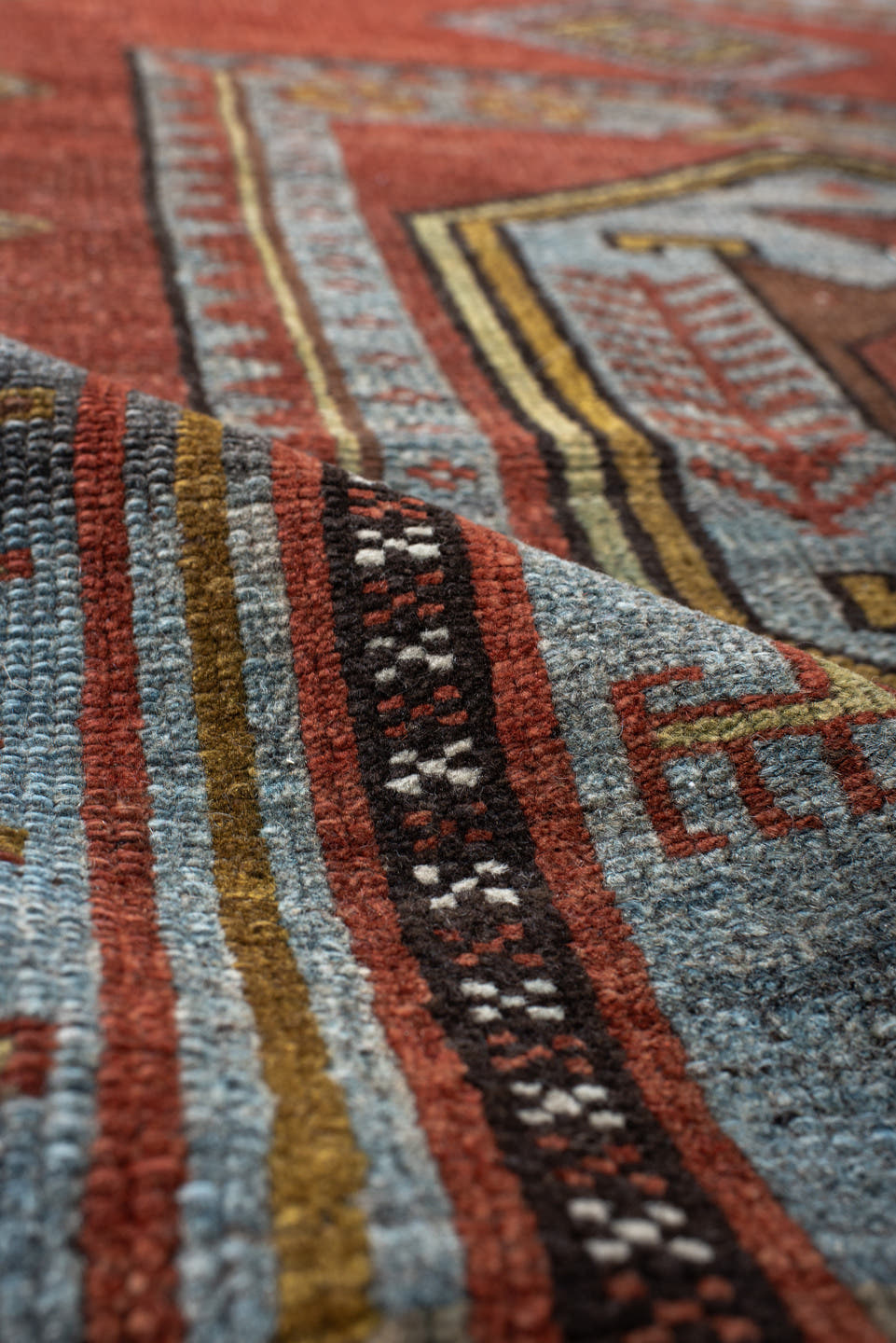 5' x 10' one-of-a-kind handmade antique NW Persian medium size rug. Color palette: rust, ivory, sky blue, camel, charcoal
