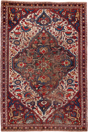 4' x 6' one-of-a-kind handmade vintage small size rug. Color palette: ivory, red, navy, cobalt, rust, camel, brown, blue