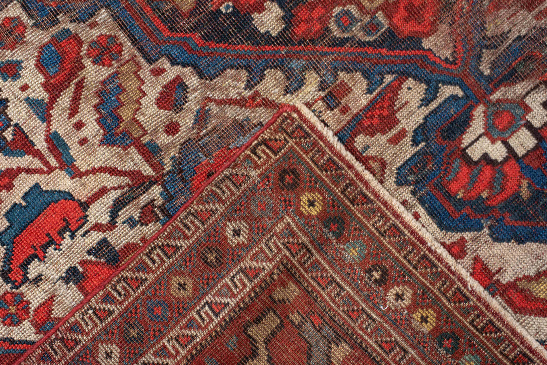 4' x 6' one-of-a-kind handmade vintage  small size rug. Color palette: ivory, red, navy, cobalt, rust, camel, brown, blue