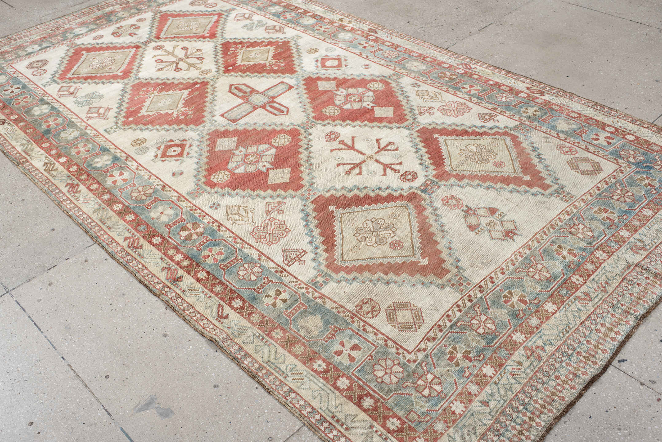 5' x 10' one-of-a-kind handmade vintage Shiraz medium size rug. Color palette: ivory, terra cotta, sky blue, rust, beige