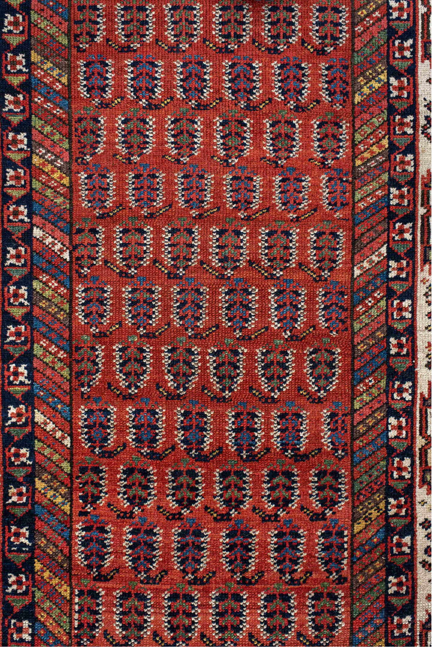 4' x 11' one-of-a-kind handmade antique NW Persian runner rug. Color palette: rust, ivory, indigo, navy, terra cotta, camel