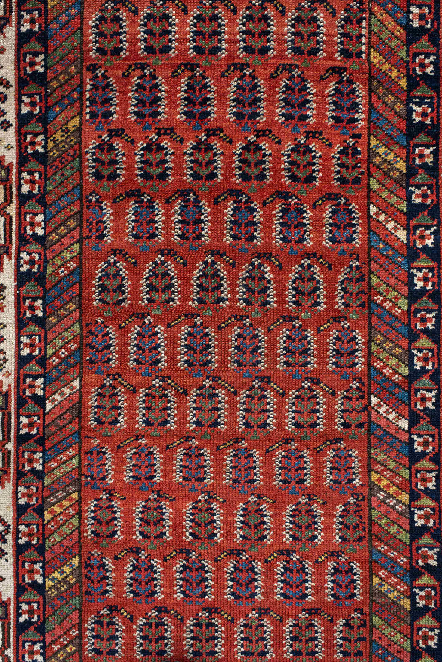4' x 11' one-of-a-kind handmade antique NW Persian runner rug. Color palette: rust, ivory, indigo, navy, terra cotta, camel