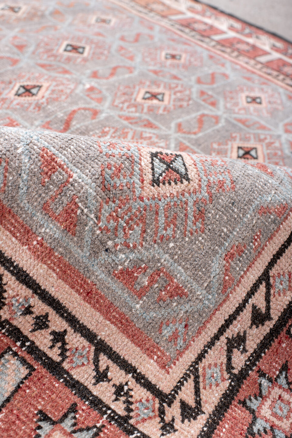 4' x 7' one-of-a-kind handmade vintage Sparta rug. Color palette: black, brown, gray, light gray, off-white, pink, red