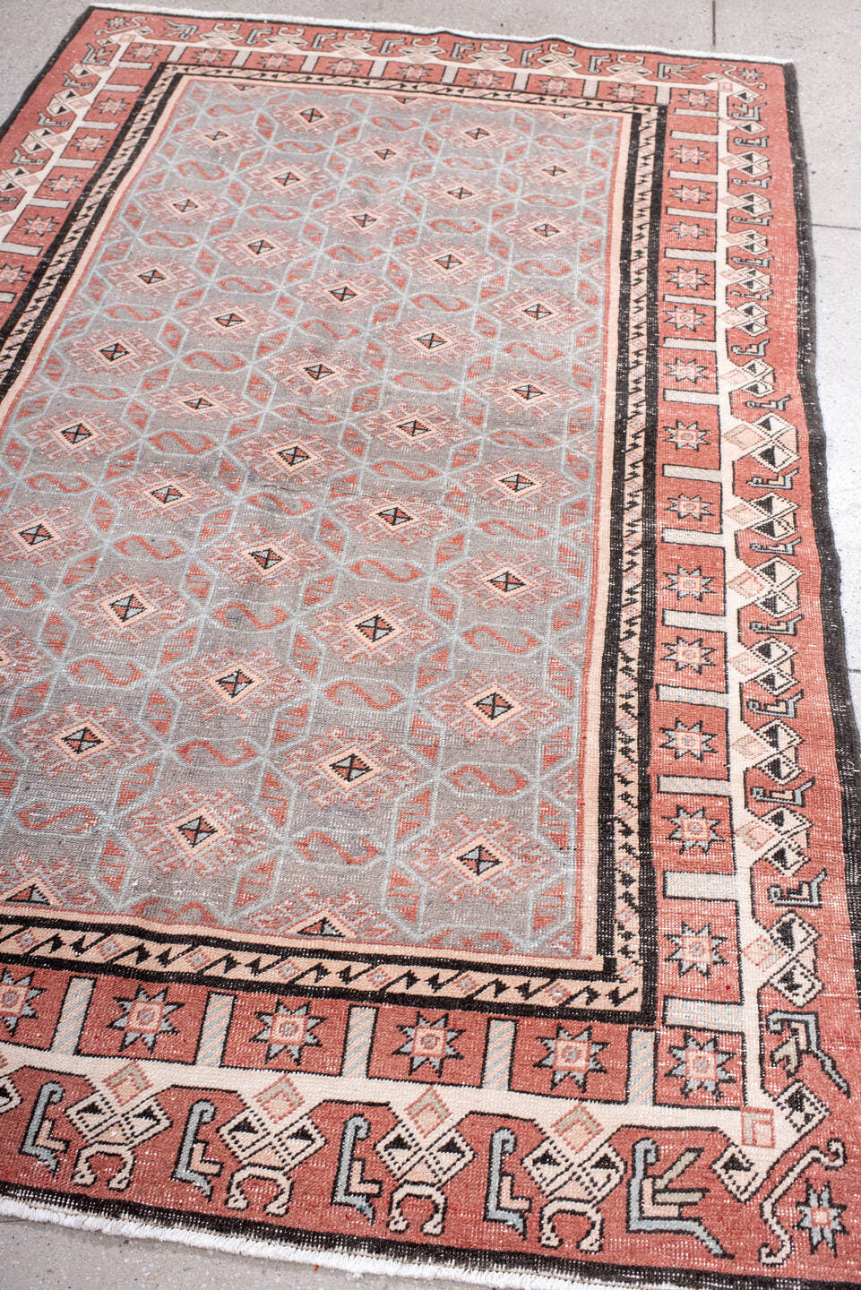 4' x 7' one-of-a-kind handmade vintage Sparta rug. Color palette: salmon, gray, ivory, charcoal, rose, taupe, pink, black