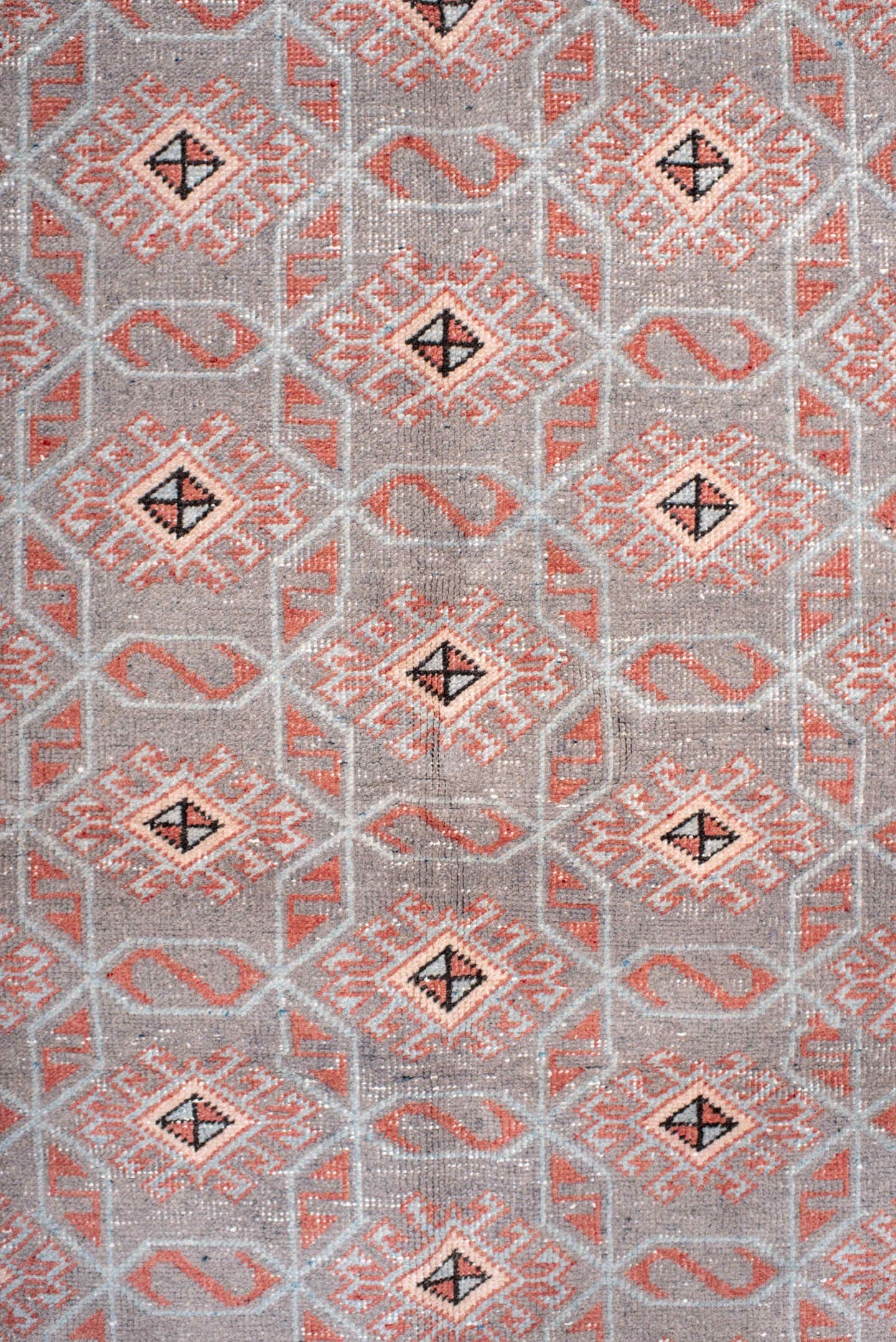 4' x 7' one-of-a-kind handmade vintage Sparta rug. Color palette: salmon, gray, ivory, charcoal, rose, taupe, pink, black