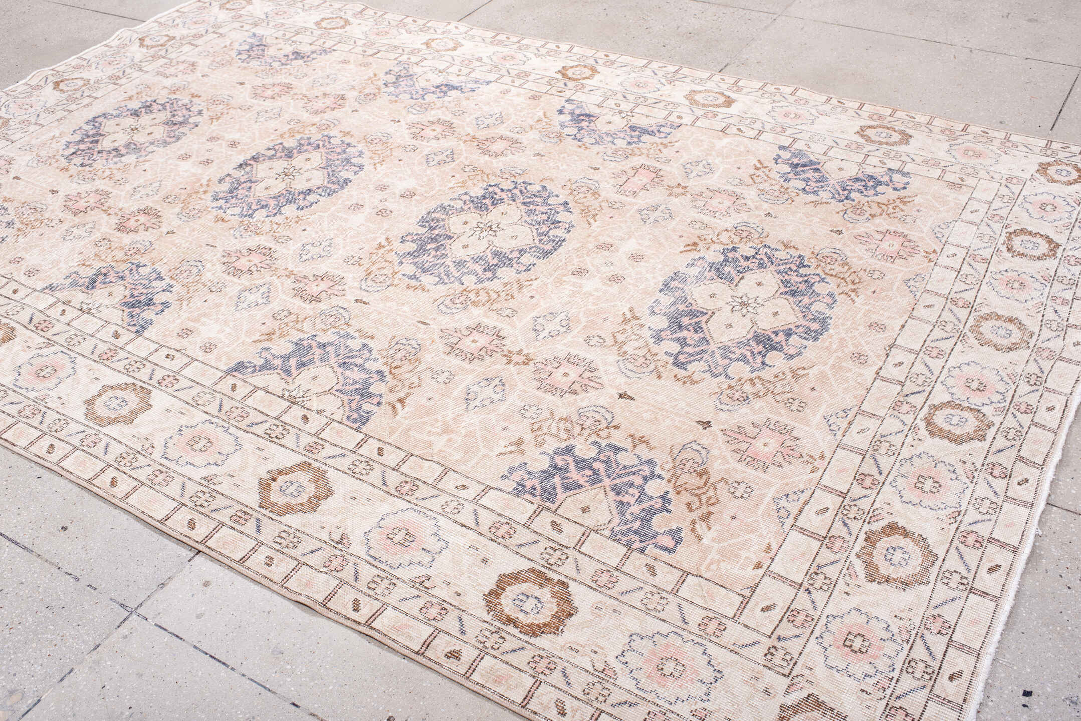 7' x 10' one-of-a-kind handmade vintage Sparta large size rug. Color palette: blush, ivory, powder blue, taupe, rose, camel