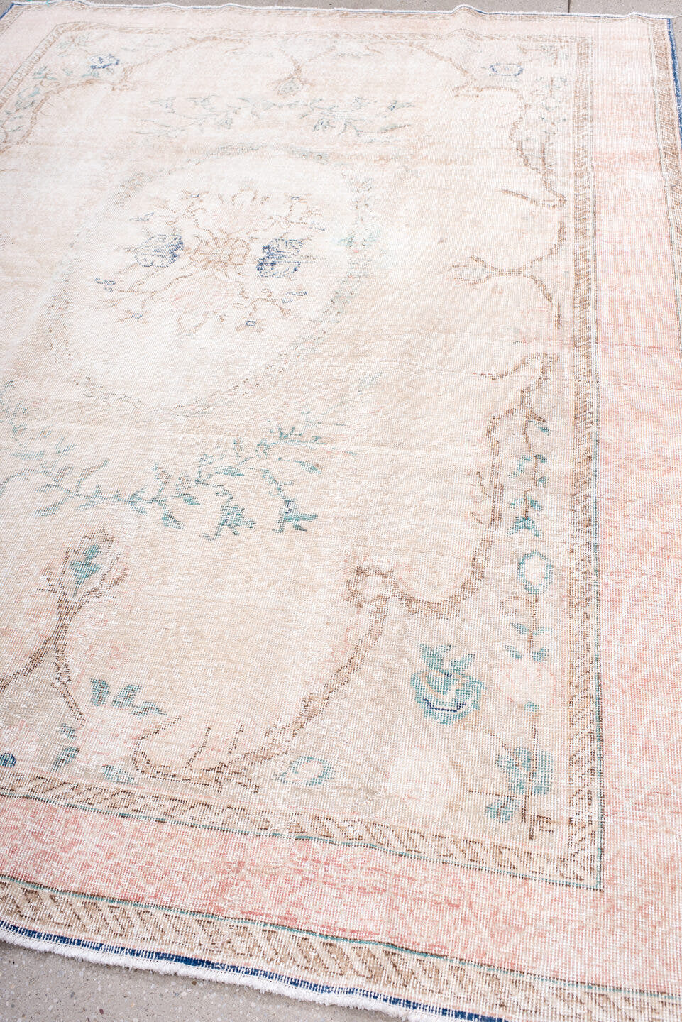 7' x 9' one-of-a-kind handmade vintage Sparta rug. Color palette: blush, ivory, pale blue, taupe, cream, pink, light blue