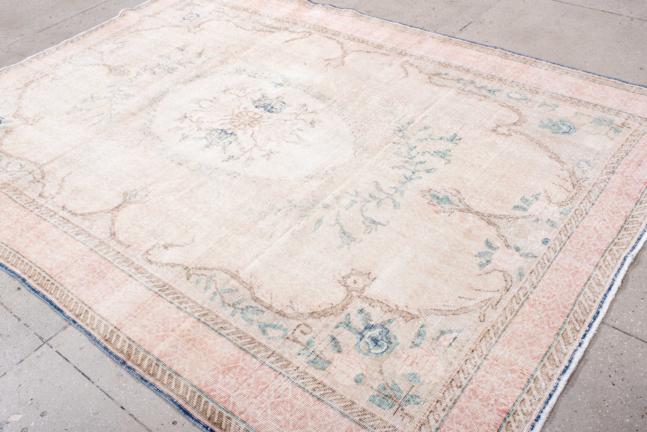 7' x 9' one-of-a-kind handmade vintage Sparta rug. Color palette: blush, ivory, pale blue, taupe, cream, pink, light blue