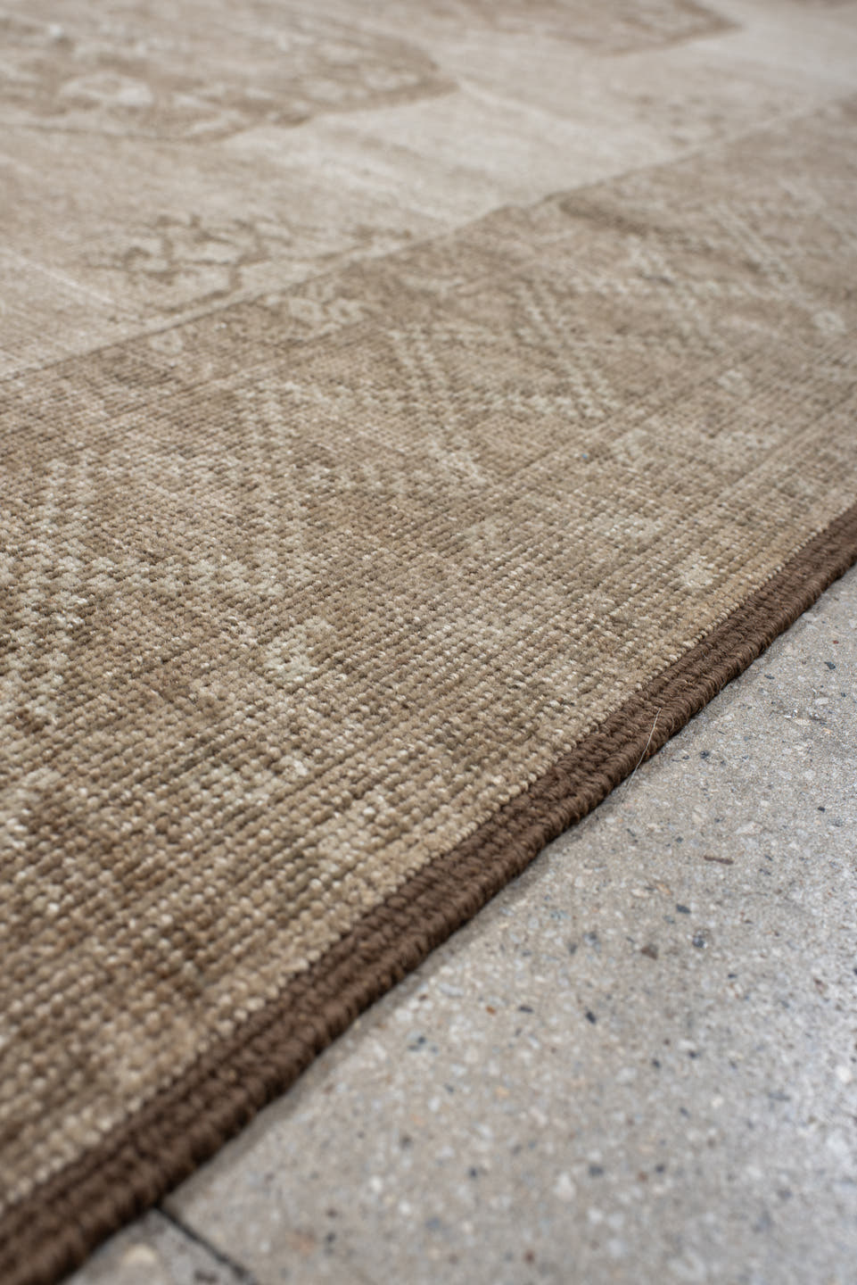 7' x 8' one-of-a-kind handmade antique Afghan rug. Color palette: ivory, taupe, camel, beige, sand, brown, gray