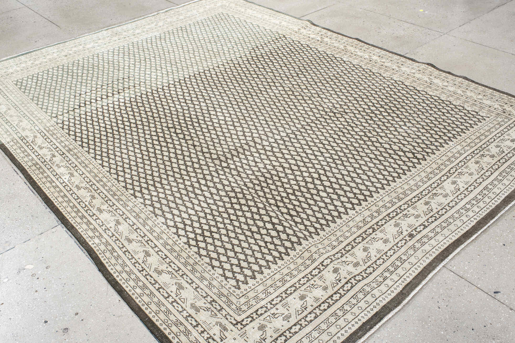 7' x 10' one-of-a-kind handmade vintage Mir large size rug. Color palette: black, floral white, gray, light gray, linen