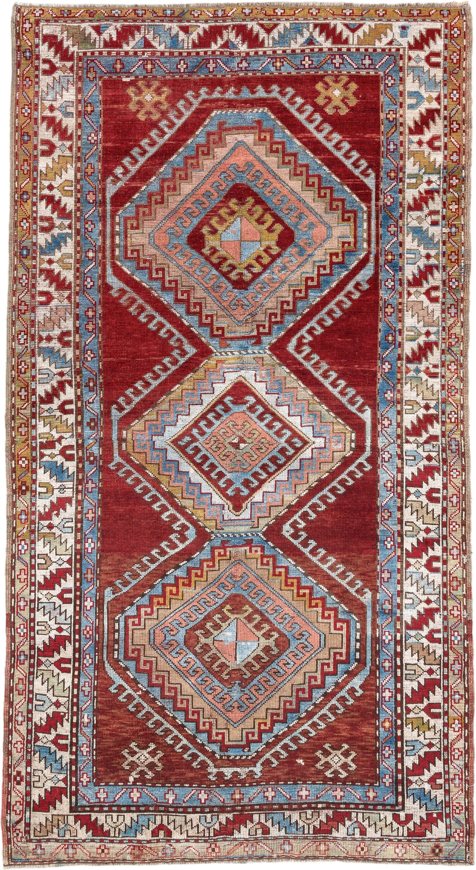 4' x 7' one-of-a-kind handmade vintage Kazak rug. Color palette: rust, ivory, sky blue, brick red, camel, taupe, gold, brown