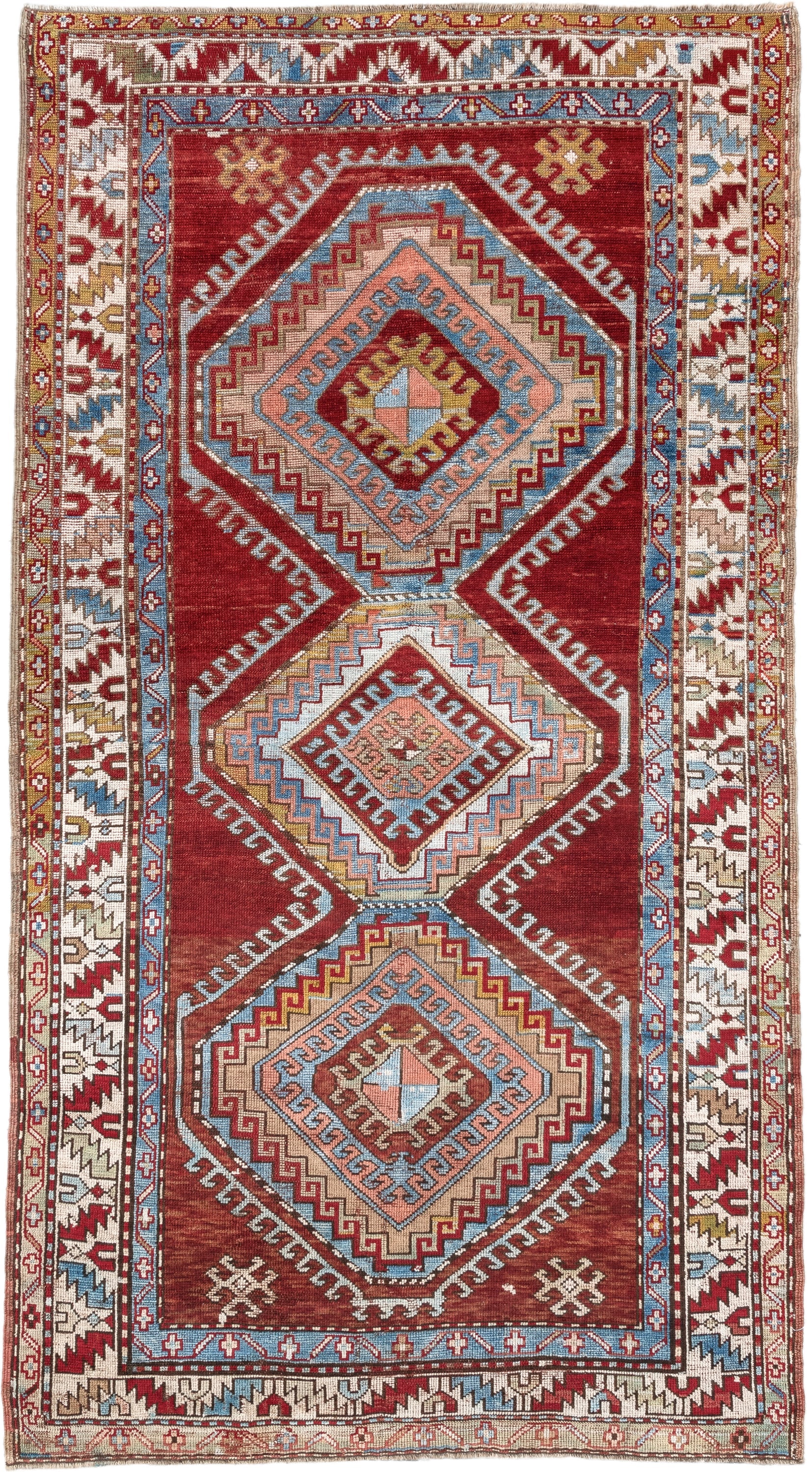 4' x 7' one-of-a-kind handmade vintage Kazak rug. Color palette: rust, ivory, sky blue, brick red, camel, taupe, gold, brown