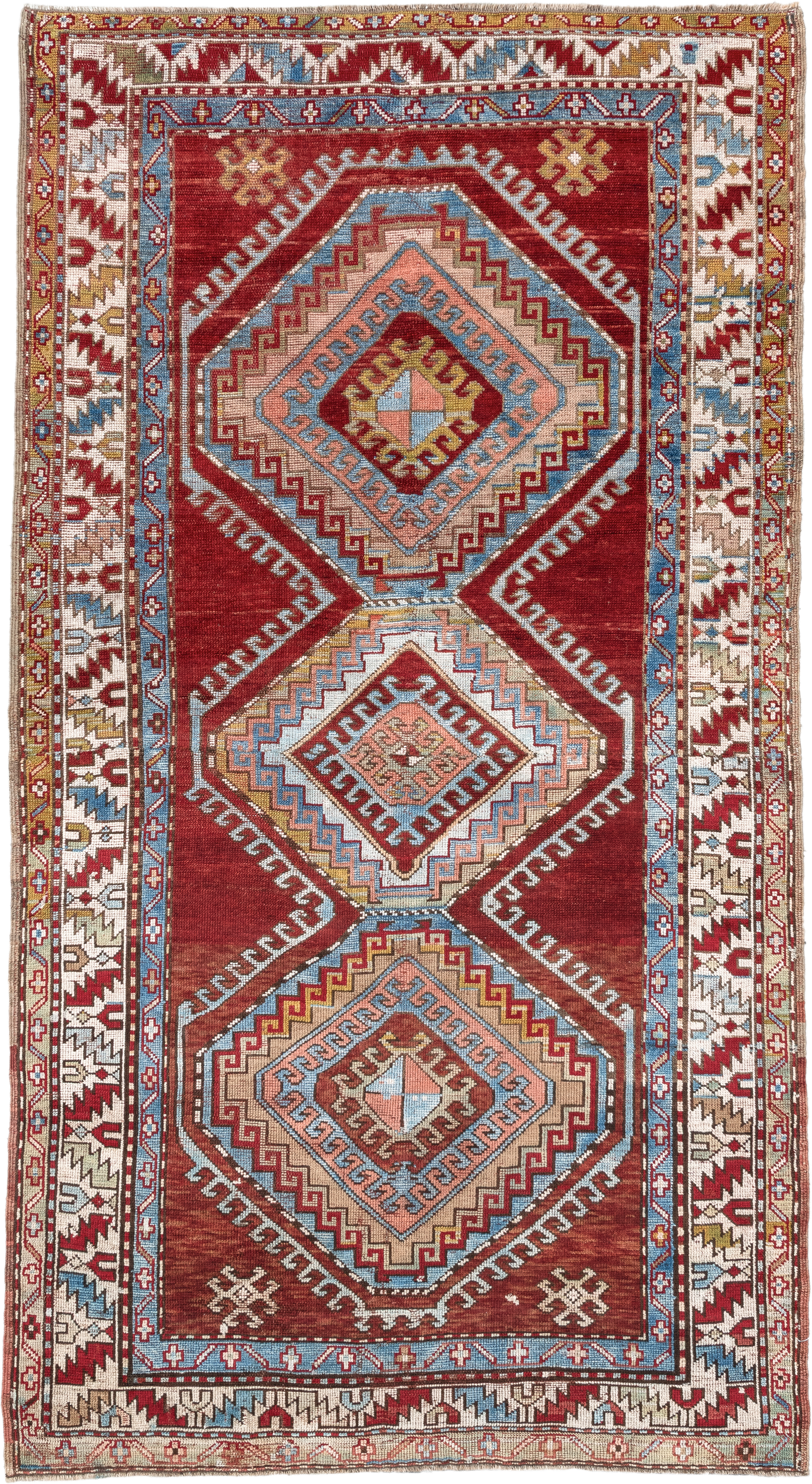 4' x 7' one-of-a-kind handmade vintage Kazak rug. Color palette: rust, ivory, sky blue, brick red, camel, taupe, gold, brown