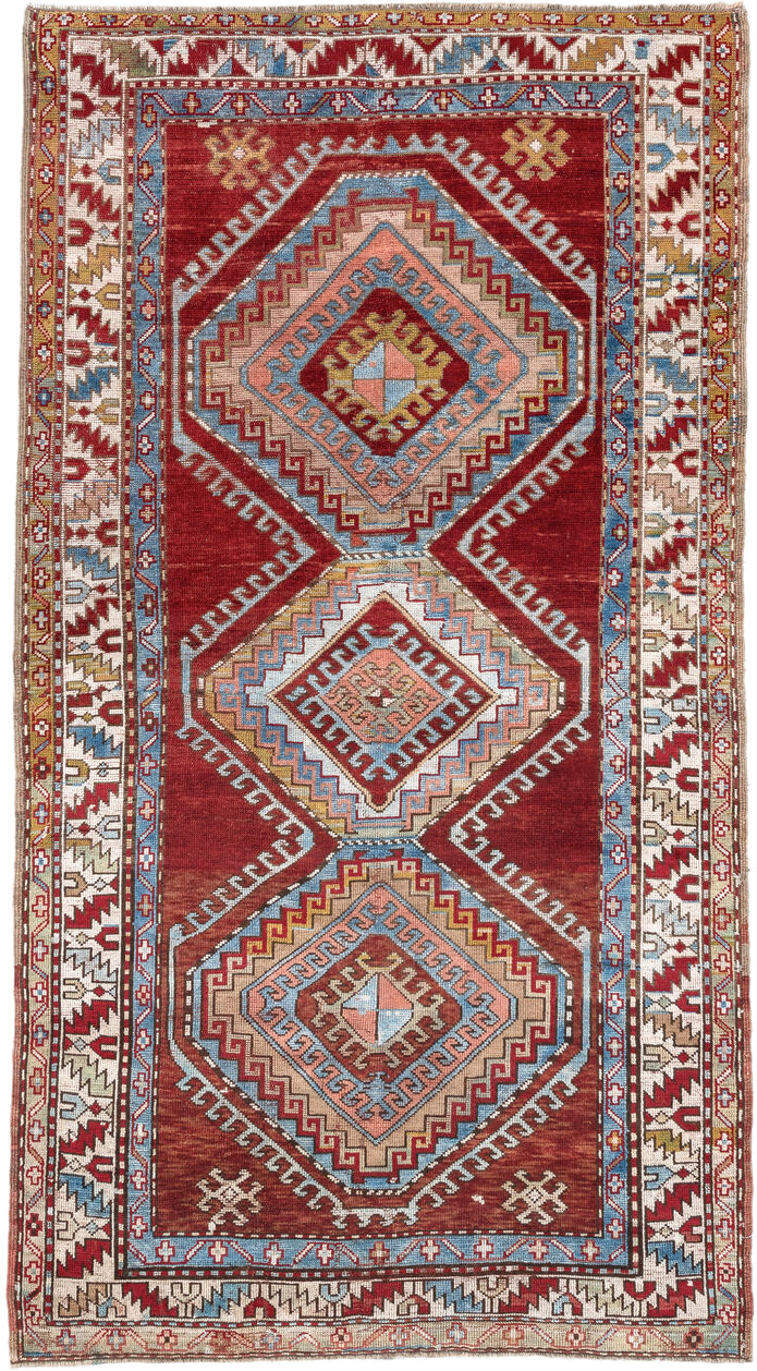 4' x 7' one-of-a-kind handmade vintage Kazak rug. Color palette: rust, ivory, sky blue, brick red, camel, taupe, gold, brown