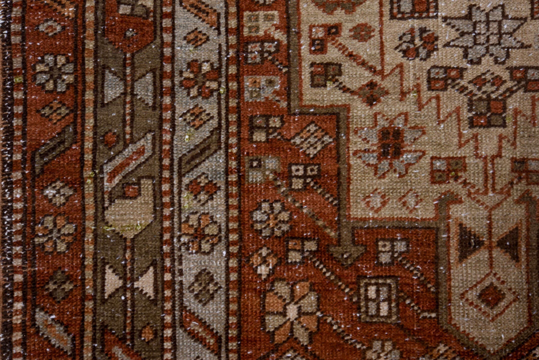 3' x 11' one-of-a-kind handmade antique Heriz runner rug. Color palette: rust, ivory, brown, taupe, charcoal, black, camel