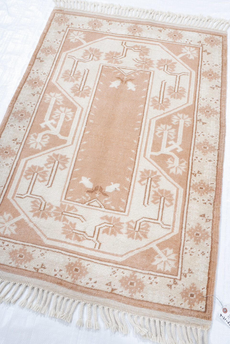 2' x 4' one-of-a-kind handmade antique Anatolian small size rug. Color palette: ivory, blush, peach, sand, camel, pink