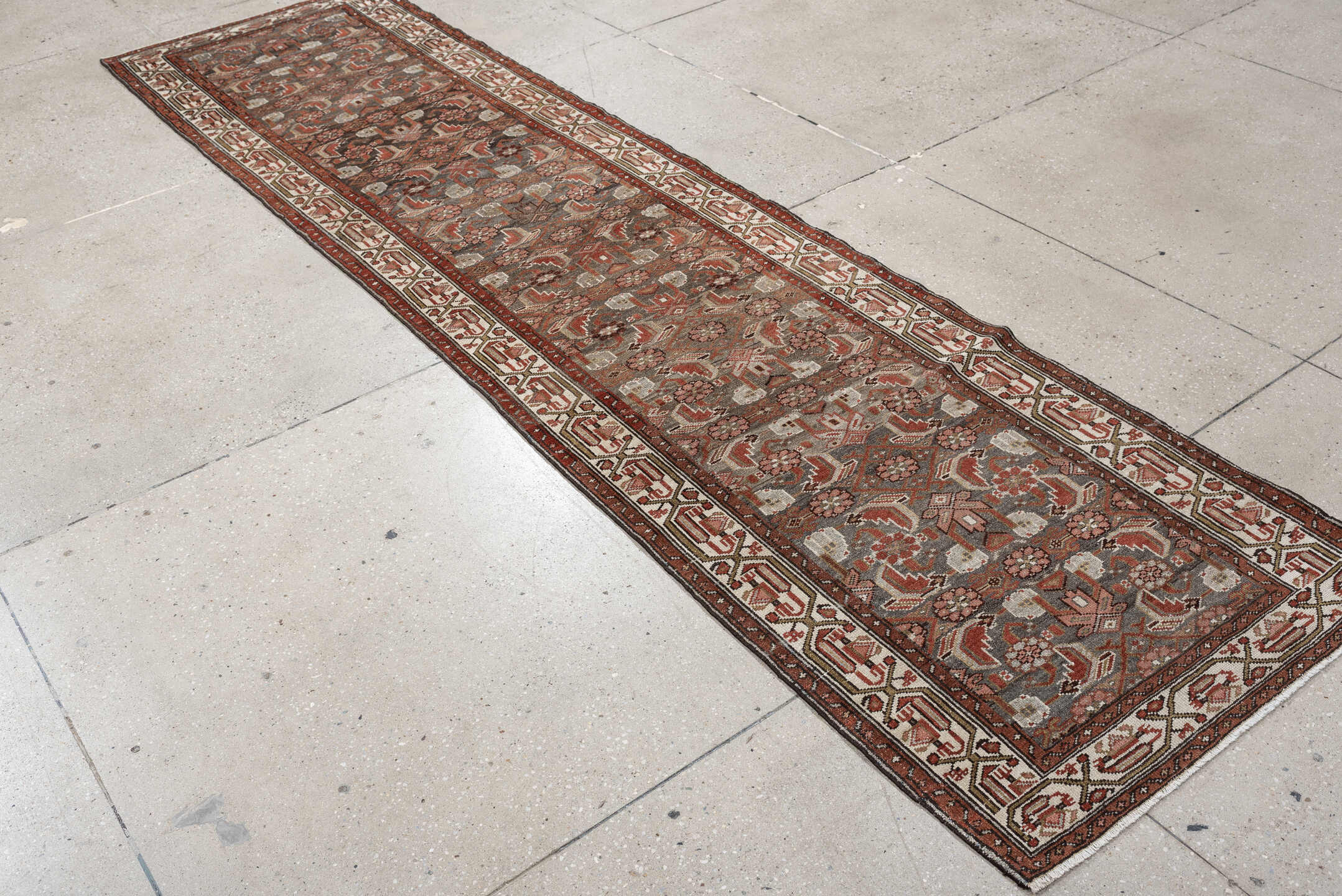 10' x 2' one-of-a-kind handmade vintage  rug. Color palette: slate, rust, ivory, terracotta, rose, charcoal, taupe, gray