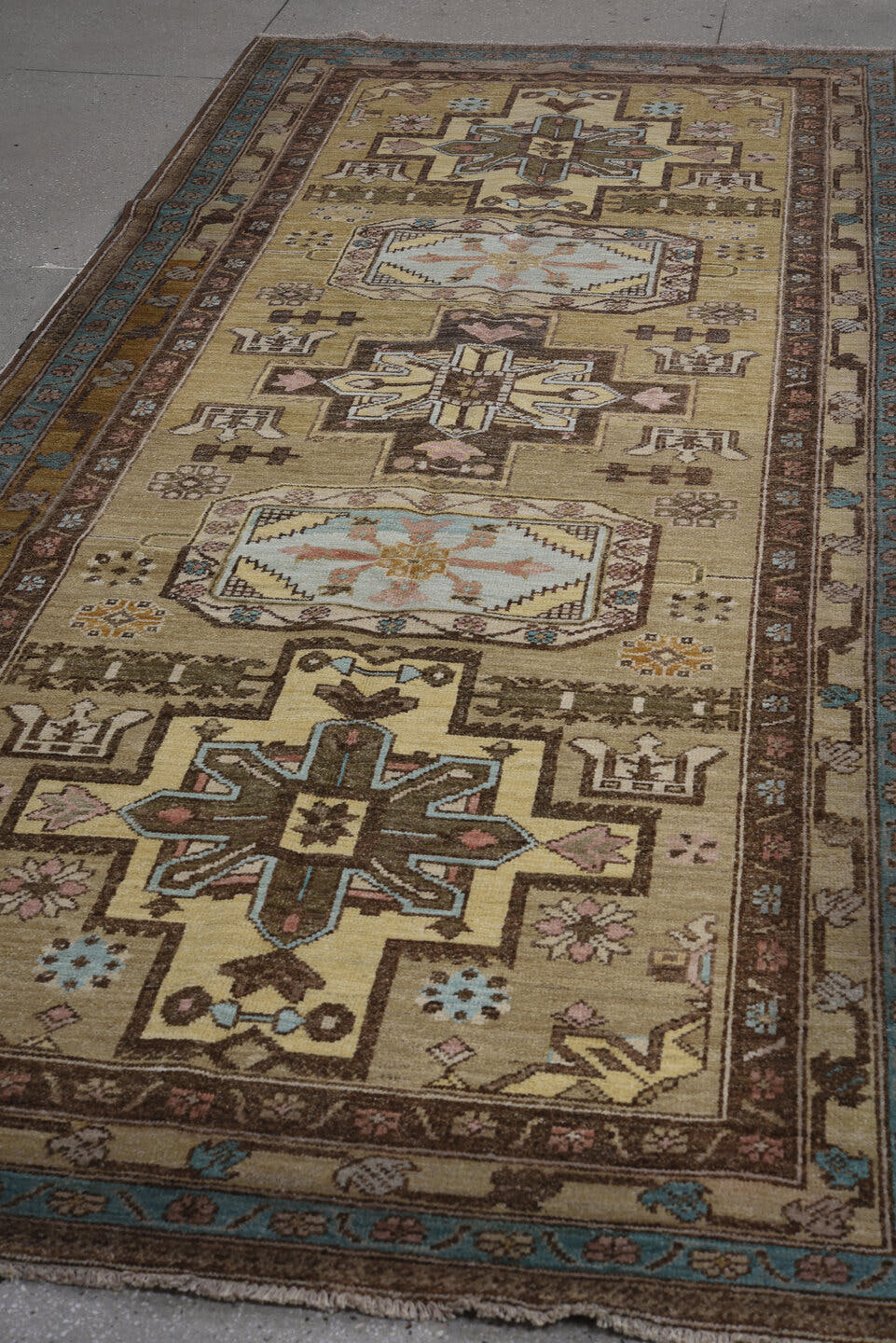 4' x 10' one-of-a-kind handmade vintage Sarab runner rug. Color palette: camel, brown, ivory, sky_blue, taupe, rose