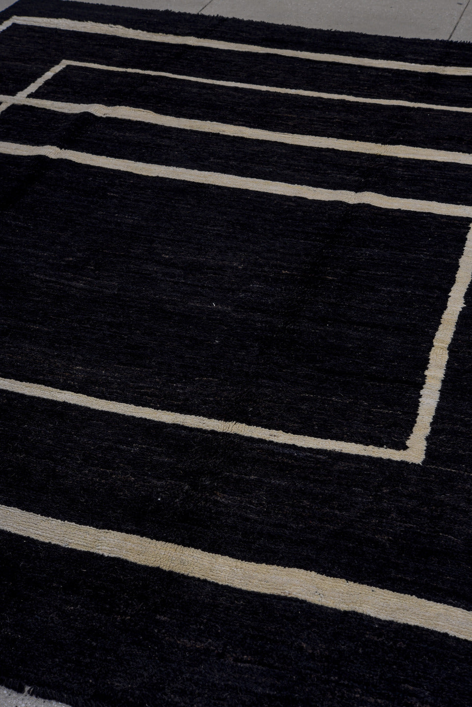 7' x 9' one-of-a-kind handmade vintage Tulu large size rug. Color palette: black, ivory