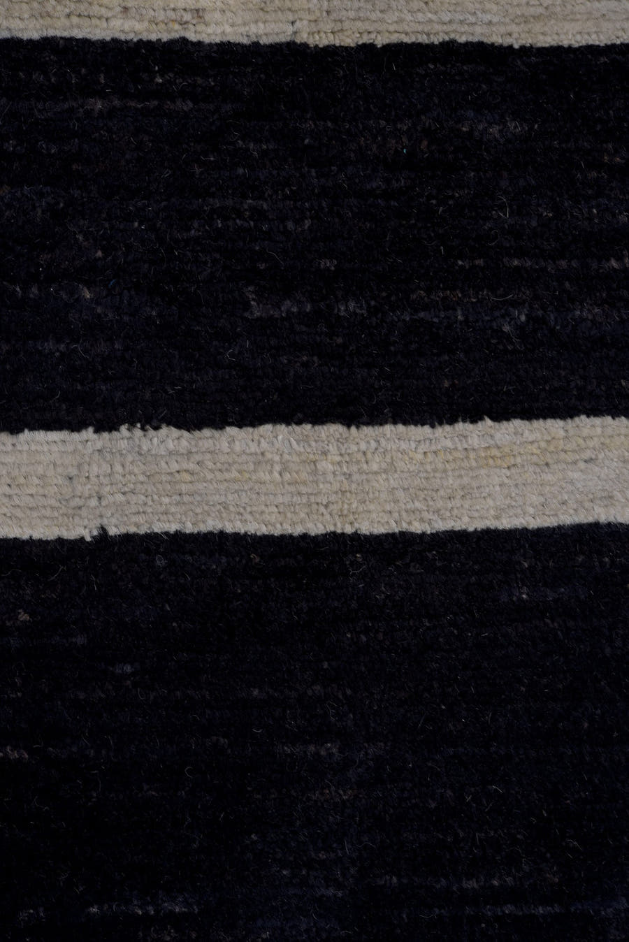 7' x 9' one-of-a-kind handmade vintage Tulu large size rug. Color palette: black, ivory