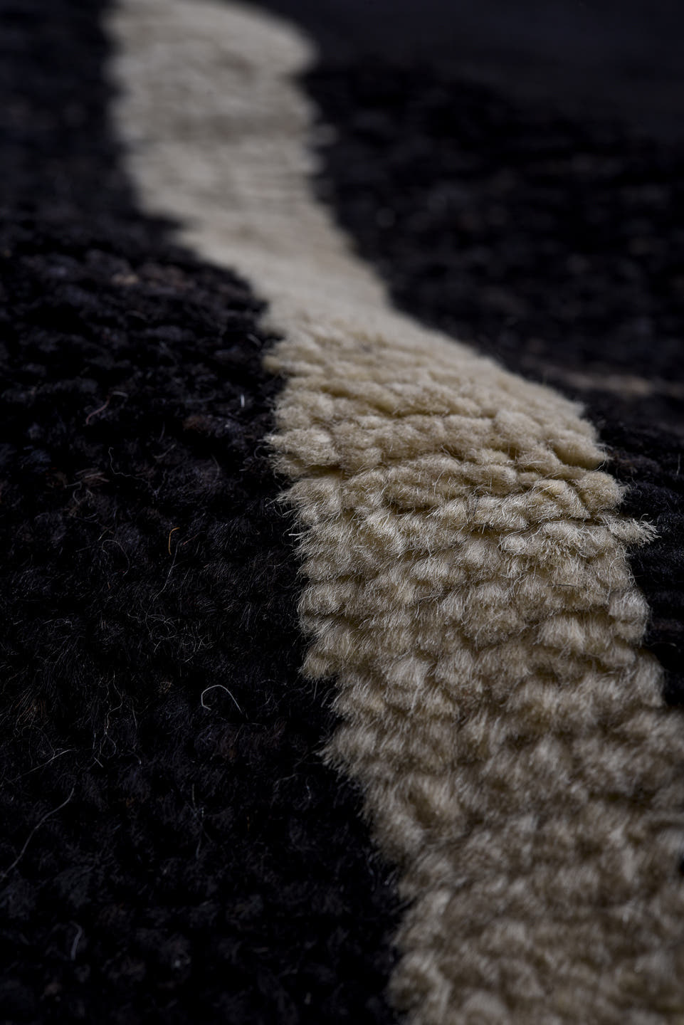 7' x 9' one-of-a-kind handmade vintage Tulu large size rug. Color palette: black, ivory