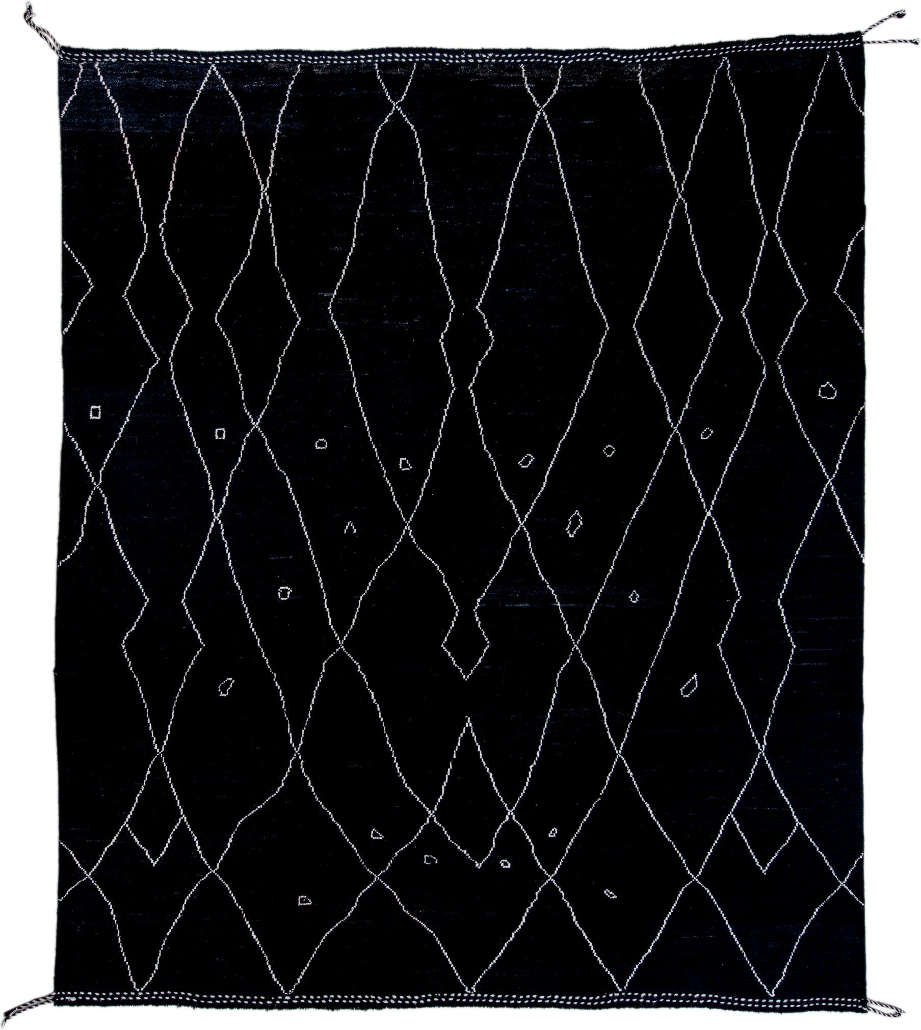 8' x 9' one-of-a-kind handmade vintage Tulu rug. Color palette: black, ivory