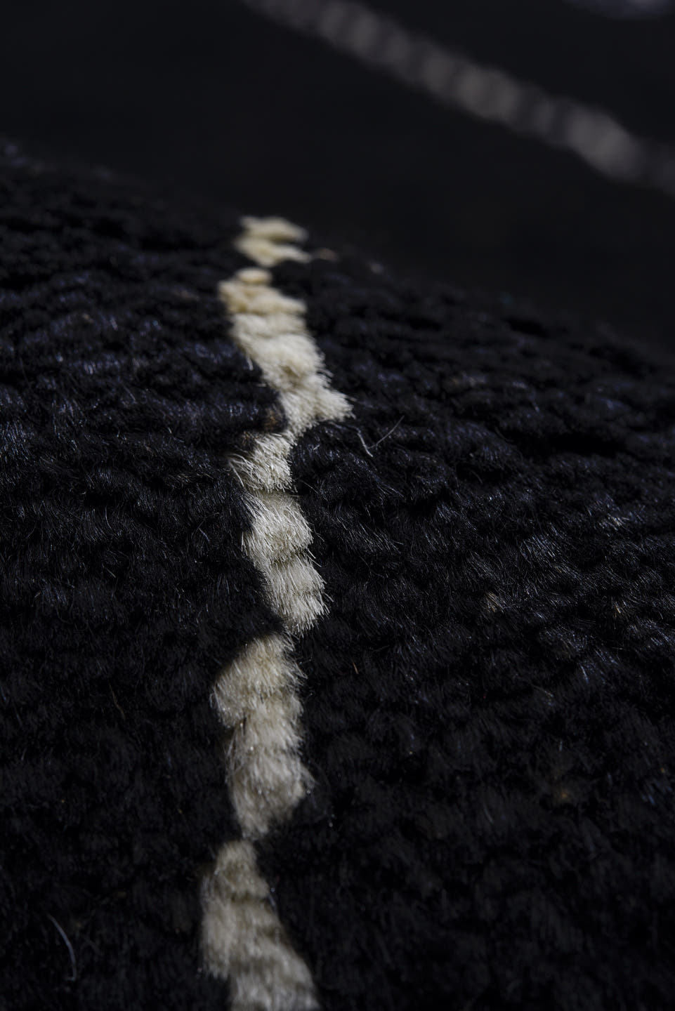 8' x 9' one-of-a-kind handmade vintage Tulu rug. Color palette: black, ivory